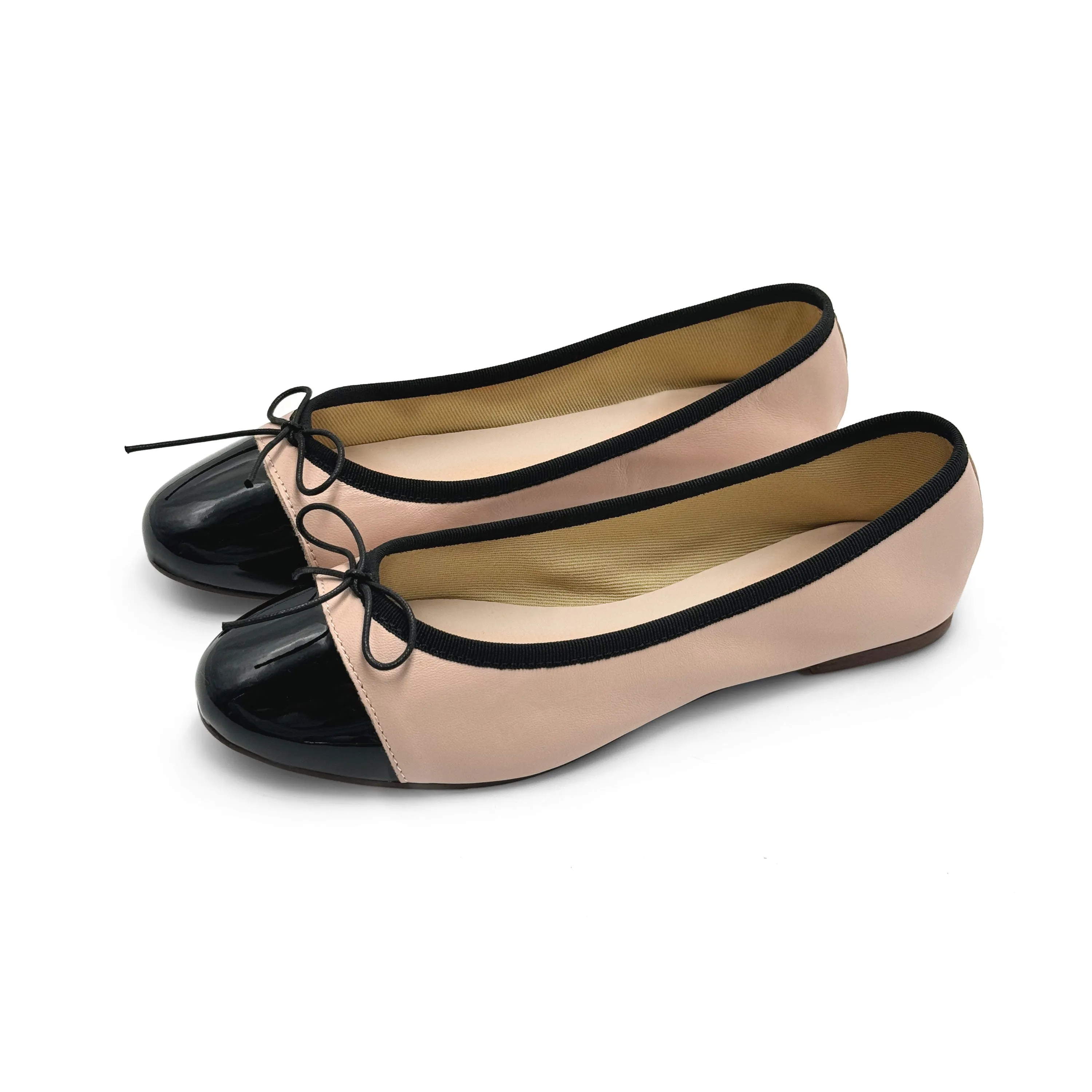 Blush pink leather ballet flats with black patent toe